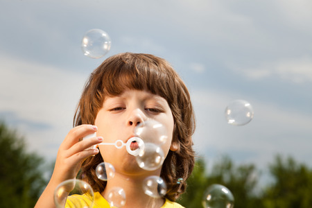boy play in bubblesの写真素材