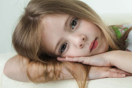 portrait of a girl in a white roomの写真素材