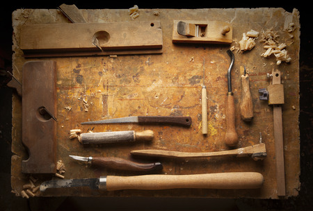 Hand tools Wood (Drill Jig Saw plane chisel) on an old wooden workbench