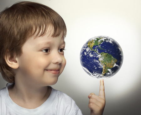 happy boy with planet Earth in handの写真素材