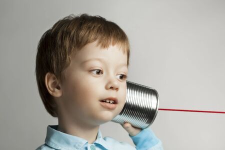 beauty boy listen tin can telephoneの写真素材