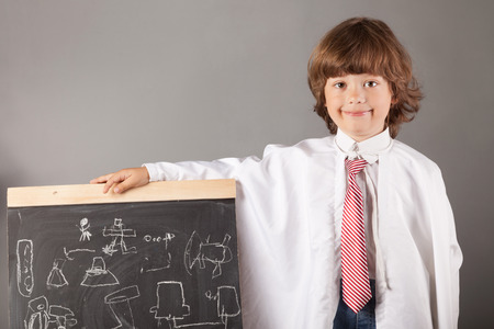 boy primary school students at blackboard