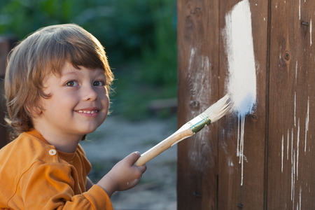the happy boy with paint brush.の写真素材