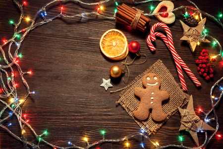 gingerbread Christmas tree and gifts on wooden table (top view)