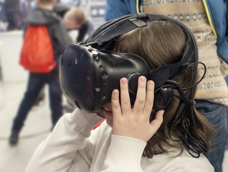 boy with glasses of virtual reality, the child tries new technology