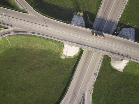 Aerial Top View of Truck with Cargo Semi Trailer Moving on Road in Direction.