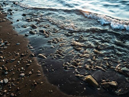 Black sea wave and sky at sunset