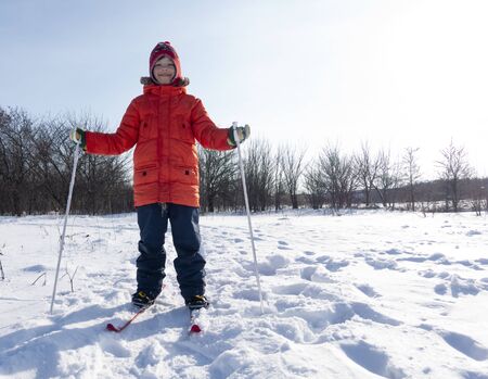 happy boys with Skis in winter outdoors.の写真素材