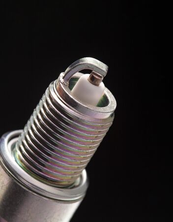 spark plug on black background