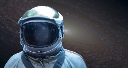 Astronaut in a front of stars in outer space.
