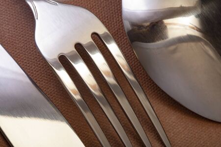 silverware fork, knife, spoon on white table