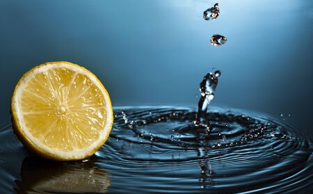 orange fruit slice in water streamの写真素材