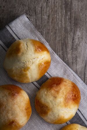 Hot cross buns on basket Top view, copy space. Easter baking.