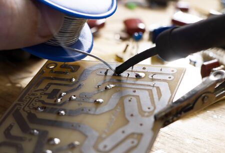 Soldering of electronic circuit board with electronic components.