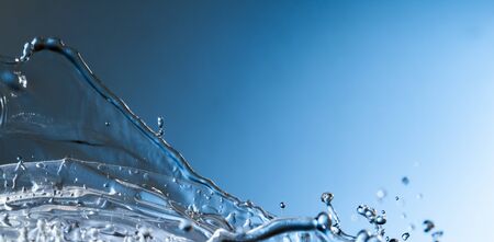 abstract drop water splash on blue background.