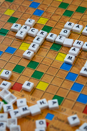 Belgorod , Russia - APR, 20, 2020: Scrabble on the floor. Board game Chips are lined in a crossword.のeditorial素材