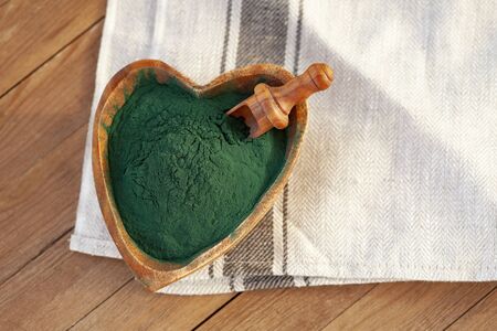 Ground Spirulina on wood backgroundの写真素材