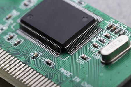 computer processor chip on a circuit board with microchips and other electronic parts CPU Chip on Motherboardの写真素材