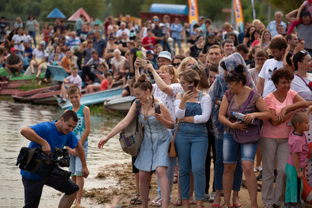 crowd of people at the pond Belgorod , Russia - JUL 25, 2019.のeditorial素材