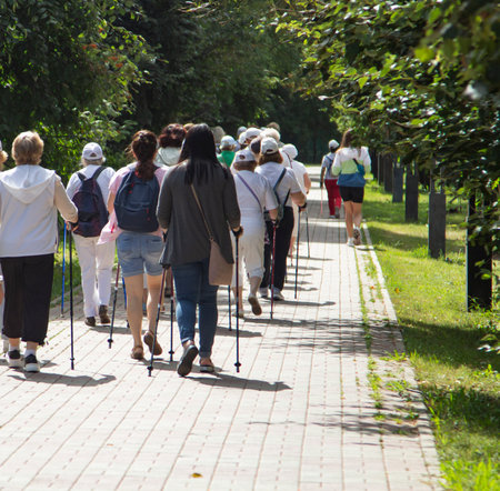 Group elderly woman practicing nordic walking in natureのeditorial素材