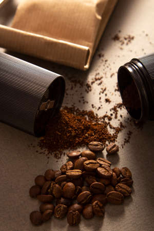 black modern manual coffee grinder and beansの写真素材