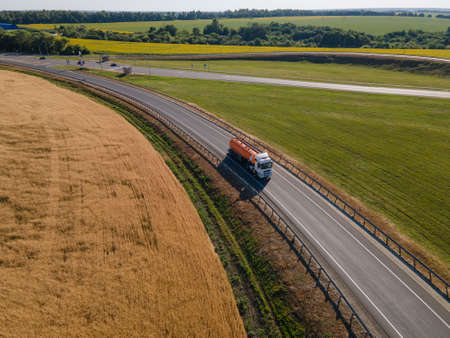Gasoline truck Oil trailer on highway driving along the road.の写真素材