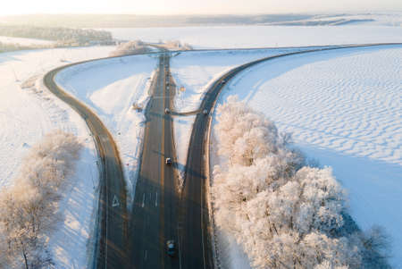 Highway intersection junction winter morning with car. Drone Aerial Top Viewの写真素材