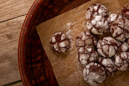 Chocolate brownie cookies with crack on white background. Cracked chocolate biscuits. Christmas...