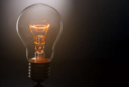 glowing lamp on black backgroundの写真素材
