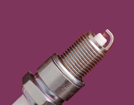 spark plug on red background