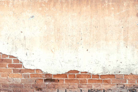 Old and rustic brick wall texture and  background. Cracked and grunge concrete vintage brick wall background.の写真素材