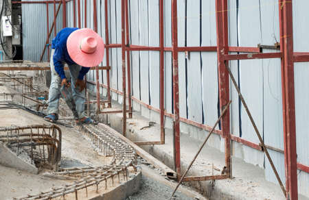 Worker use electric concrete breaker at construction site.の写真素材