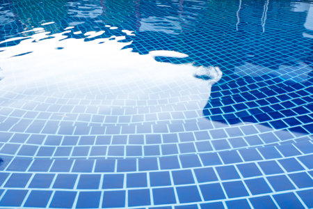 Ripped blue water in swimming pool as background.の写真素材