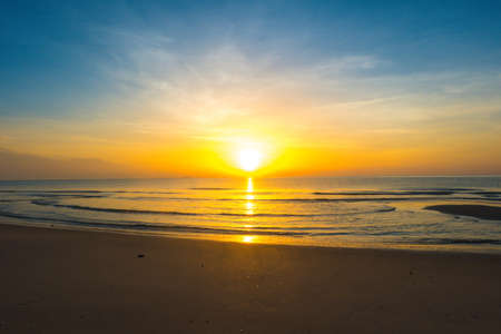Beautiful sunrise on tropical sand beach, Morning sunshine of bright day on beach.の写真素材