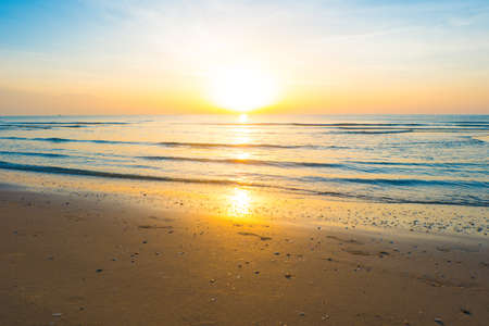 Beautiful sunrise on tropical sand beach, Morning sunshine of bright day on beach.の写真素材