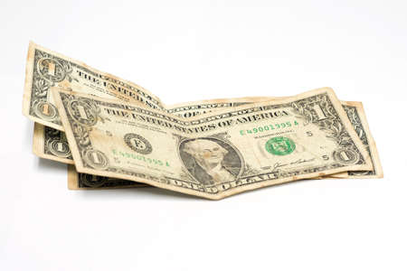 Stack of one dollar bills US money on white background.