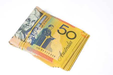 Australian money, Stack of fifty Australian dollar bills on white background.の写真素材