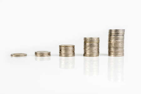 Savings, business growth, financial stability concept by several stacks of coins arrange as graph...