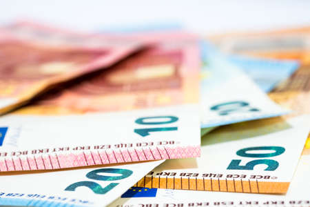 Pile of various kinds euro banknotes on white background use for money or currency and financial concepts.の写真素材