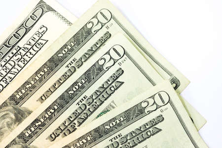 Pile twenty and one hundred dollar banknotes isolated on white background for business and financial concepts.の写真素材