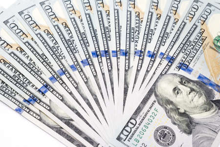 Pile of one hundred dollar banknotes as money background. New dollar bills spread in financial concept.の写真素材