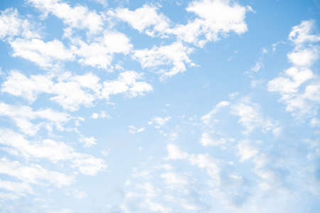 Summer blue sky and white clouds in sunny day for nature background. Soft and fluffy in sky in bright day.の写真素材