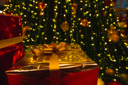 Gold gift Box Under Christmas Treeの写真素材