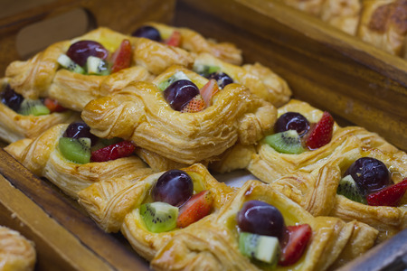 Focused and blurred fruit Bread in a tray, in a bakery.の写真素材