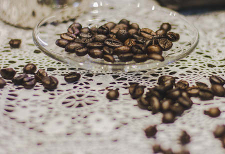 Coffee beans on glass plate. Blank space for text input.の写真素材