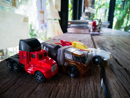 Toy car decoration on wooden desk.