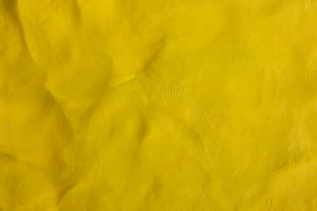 yellow Plasticine textured background.の写真素材
