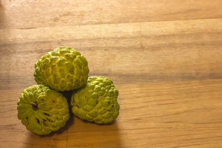 Sugar Apple (custard apple, Annona, sweetsop) on wood.の写真素材