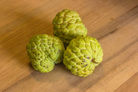 Sugar Apple (custard apple, Annona, sweetsop) on wood.の写真素材