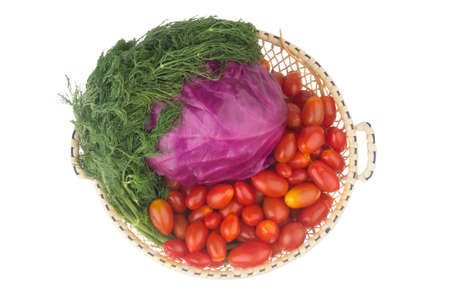 red cabbage. baby tomatoes. dill with roots. in basket. shoping. vintage. isolated on white background.の写真素材
